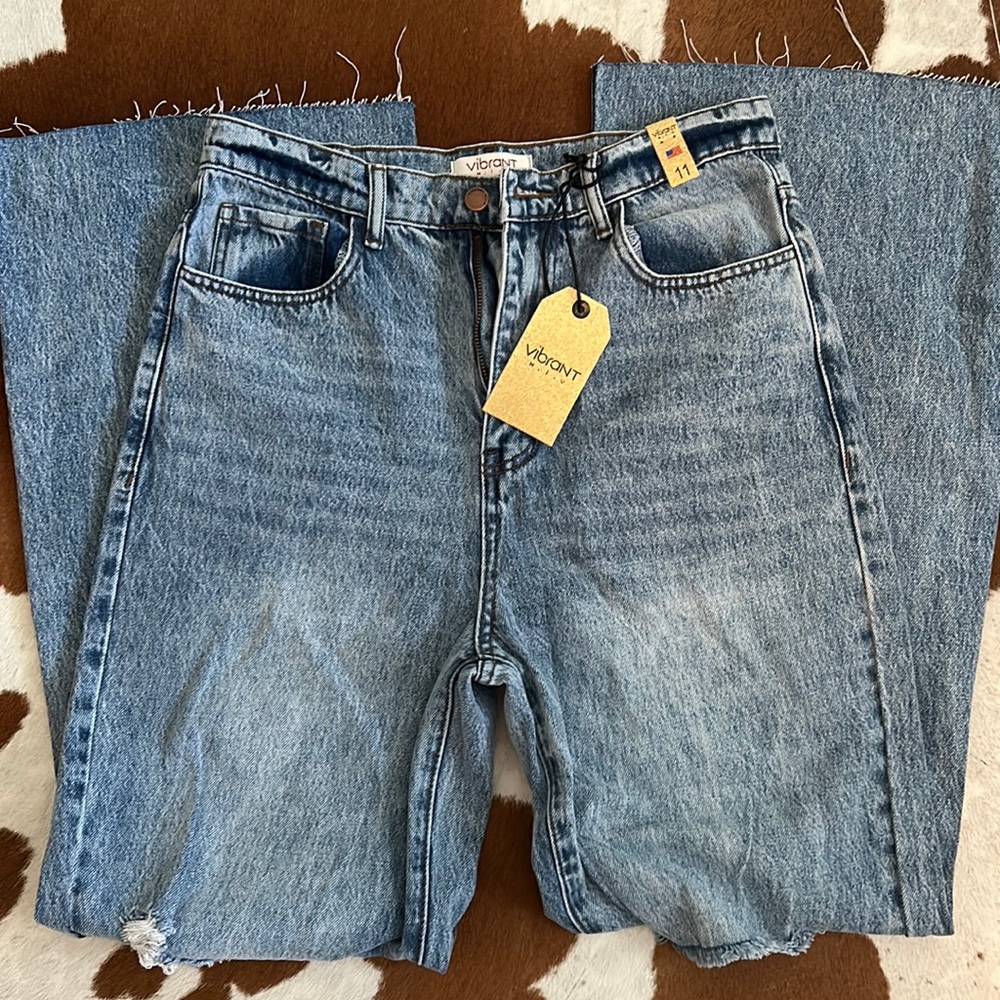 Vibrant Women’s Flared Jeans. High waist. Distressed/torn front